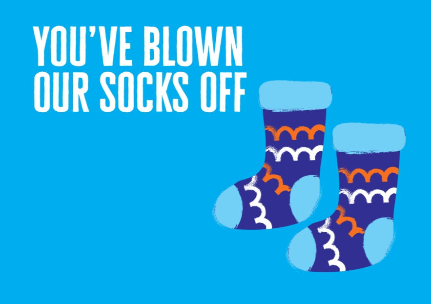 A postcard from Diabetes UK, saying "you've blown our socks off" - with a pair of blue socks on.