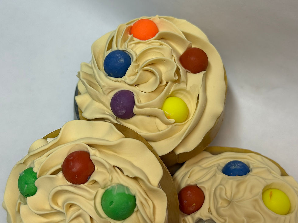 Candy coated chocolate shaped embeds top a frosted cookie shaped soap bar scented like homemade cookies