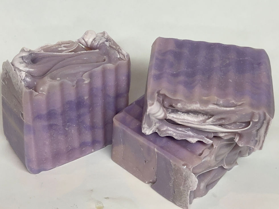 Dark purple swirls in a lavender color soap bar scented with floral and musk
