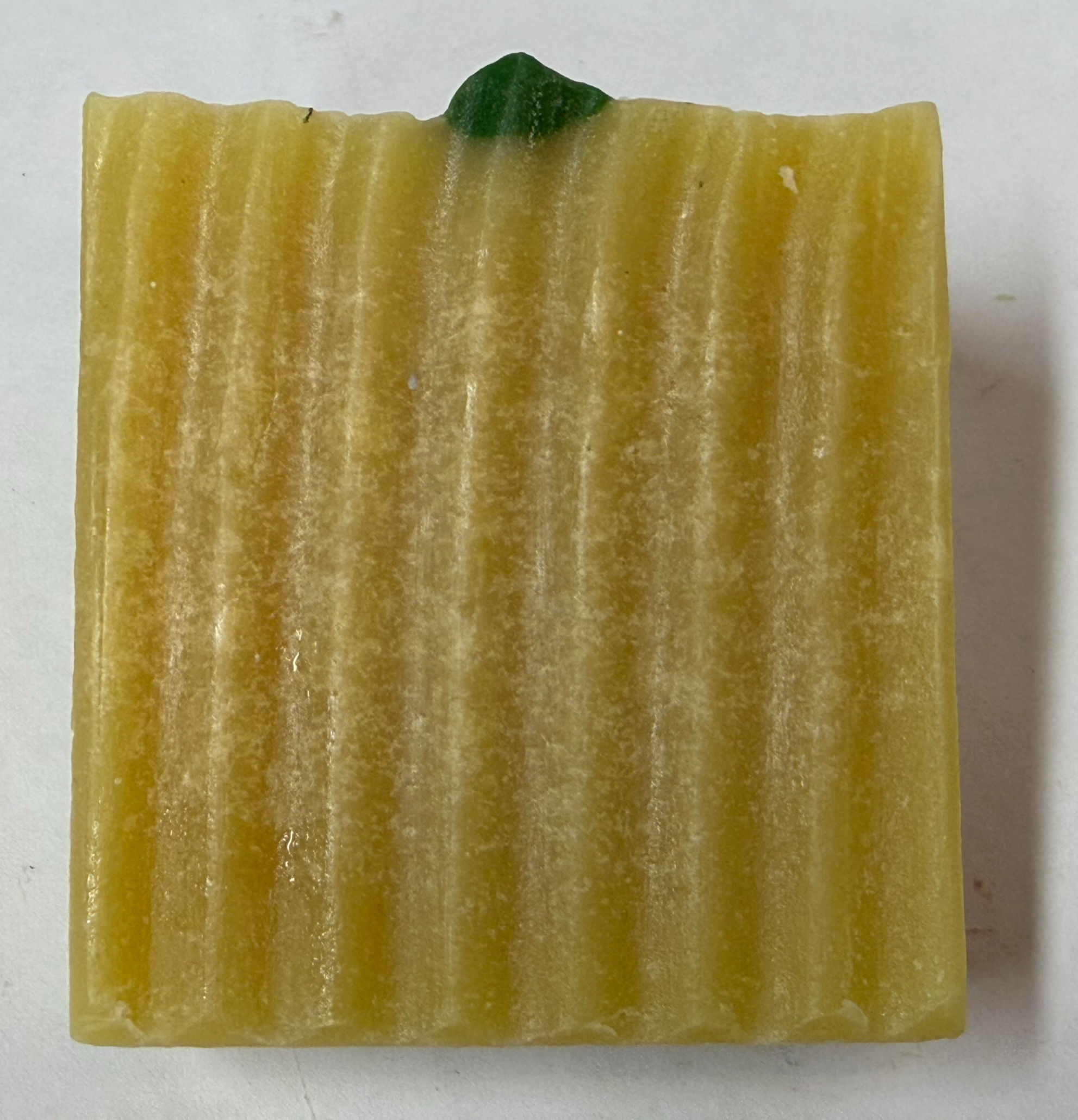 Lemon yellow soap bar with green piping