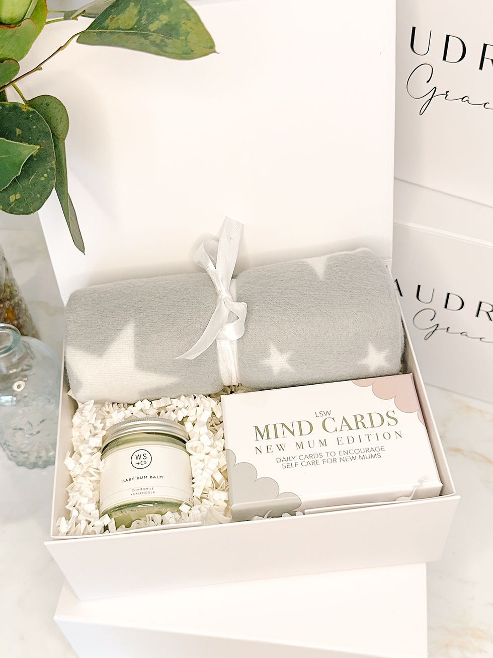 New mum gift box with soft baby blanket and self care cards