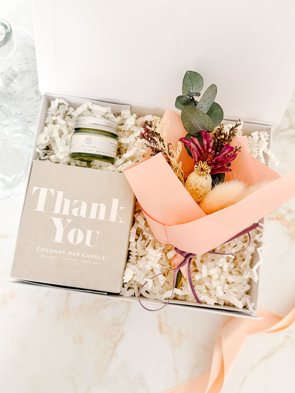 A Little Thank You gift box with thank you coconut wax candle, peppermint lip balm and dried flower posy in a luxury Audrey G