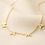 Thumbnail: Close-up of elegant gold mama charm necklace