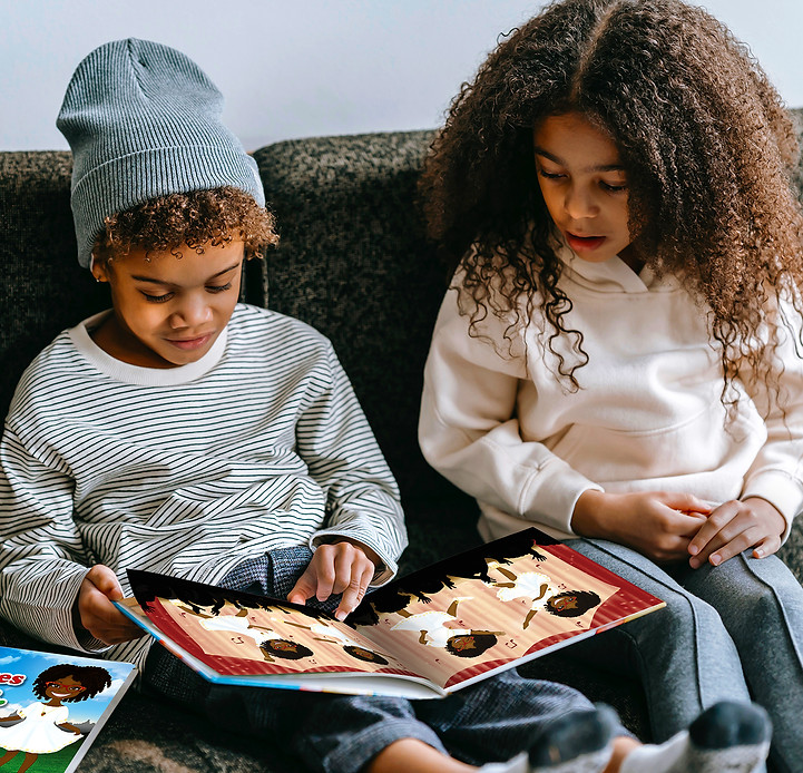 Two African American children reading Patty B books.jpg