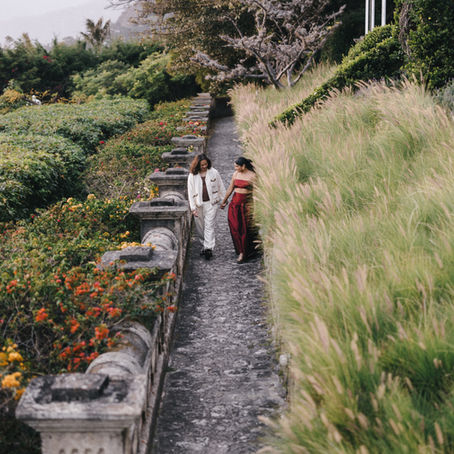 A couple walking in the gardens of Casa Palopó, Lake Atitlán, Guatemala, photographed by Mariel Orellana, one of the best wedding photographers in Guatemala.
