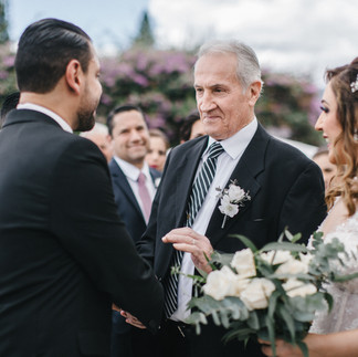 The bride’s father gives his daughter away to her future husband at a lavish wedding at the Pensativo House Hotel in Antigua Guatemala.