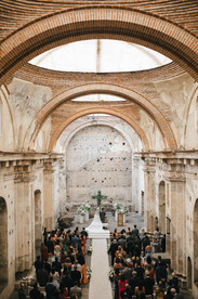 Altar and floral arrangements at the Ruins of Santa Clara during a wedding celebration in Antigua Guatemala