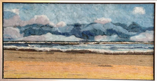 schilderij van de zee met golven. Gemaakt van gekleurde wol