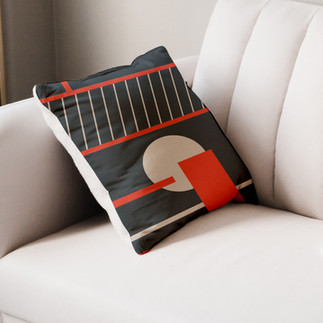 Coussin design, noir et rouge, parfait pour rehausser le style d'un canapé ou d'un lit,  et ajouter une touche moderne à la décoration intérieure.