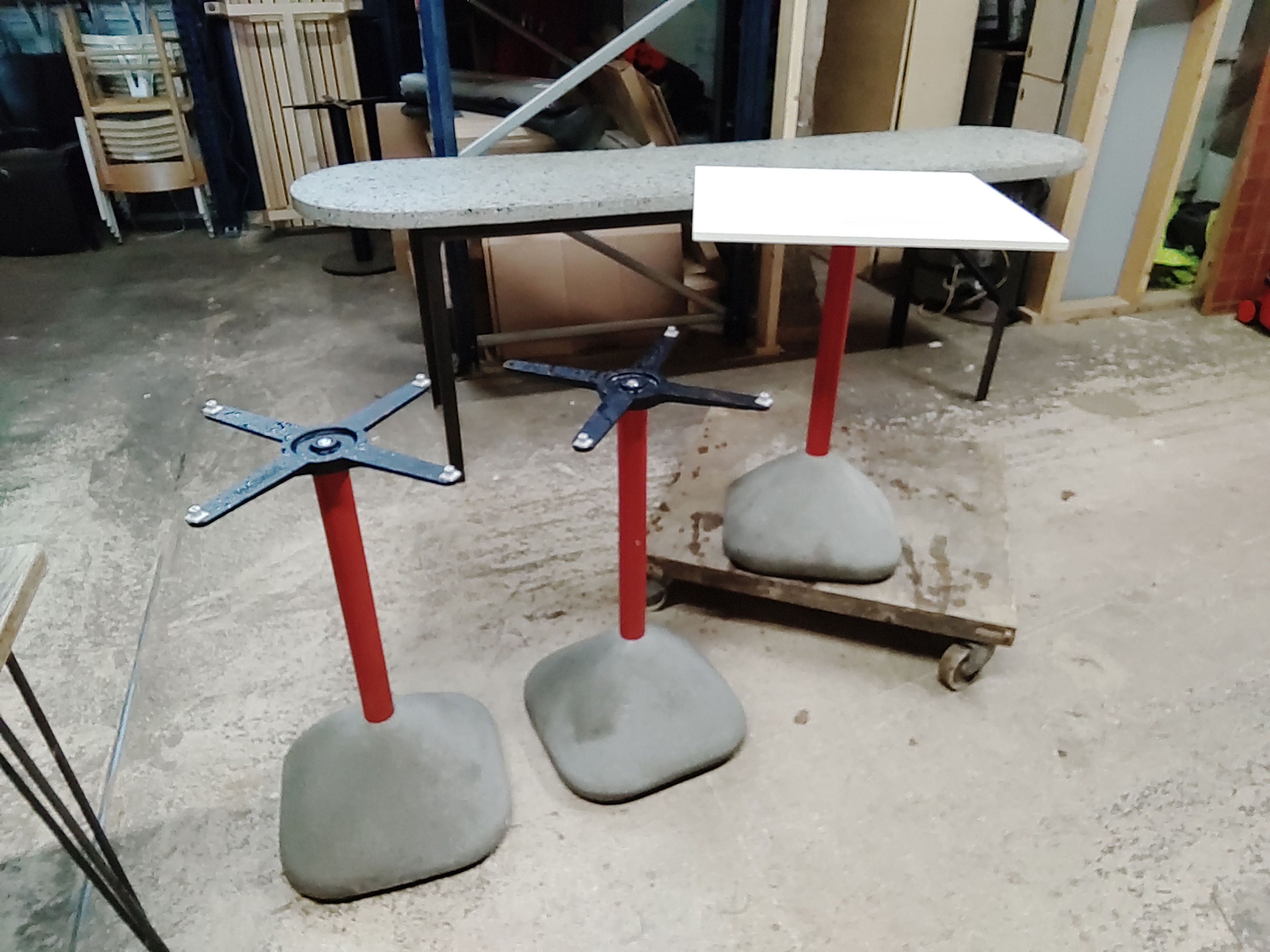 outdoor patio tables, concrete bases.