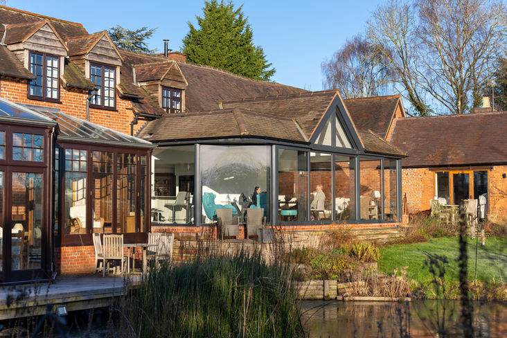 Large bespoke glazed extension transforming a rural family property, highlighting premium house extension and renovation work by specialists in the West Midlands.