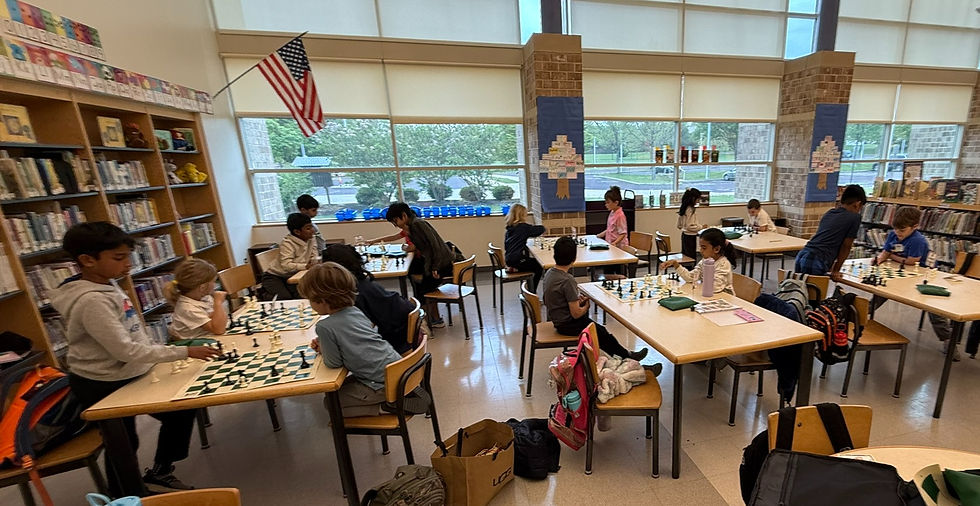 Students playing chess at a Chester County elementary school club.