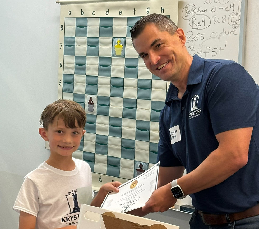 Student receiving Scholar award at Keystone Chess Academy chess camp in Chester County.