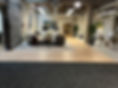 Commercial office space featuring a combination of wood-look flooring and carpet tiles, designed for durability, comfort, and modern work environments
