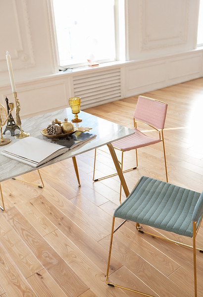Elegant dining area with natural hardwood flooring, showcasing a bright residential interior and professionally installed wood floors.
