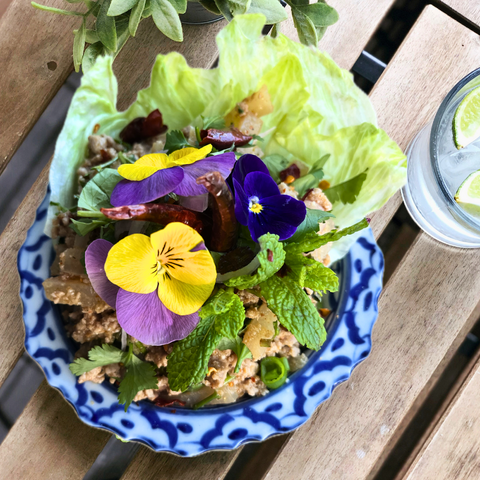Delicious Thai salad with edible flowers