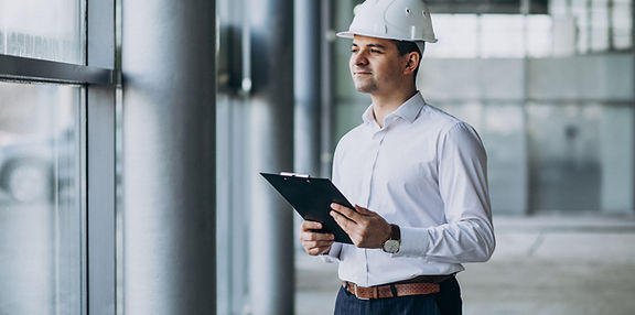 handsome-business-man-engineer-hard-hat-building.jpg