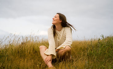 woman-enjoying-nostalgic-sunset-country-side.jpg