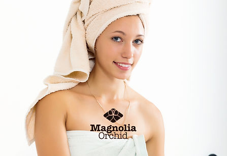 a lady putting on towel and a white headgear