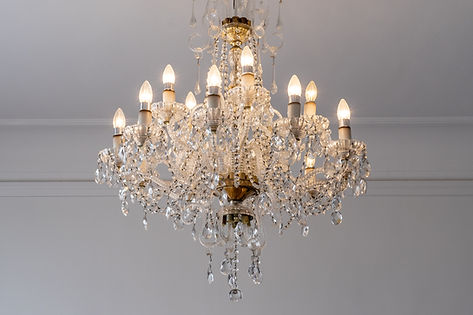 low-angle-view-illuminated-chandelier-hanging-from-ceiling.jpg