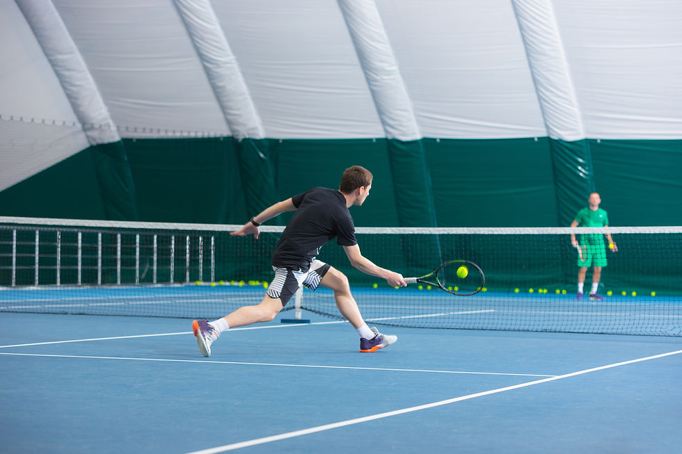 young-man-closed-tennis-court-with-ball.jpg