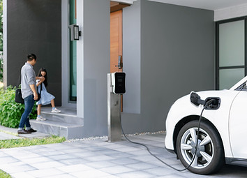 focus-progressive-ev-car-home-with-blur-father-his-daughter-background.jpg