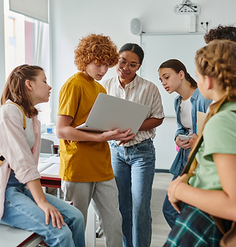 redhead-schoolboy-showing-laptop-african-american-teacher-near-classmates-back-school-conc