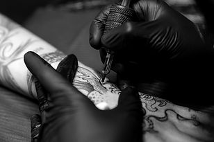 Tattoo artist creating fine line tattoos in Calgary