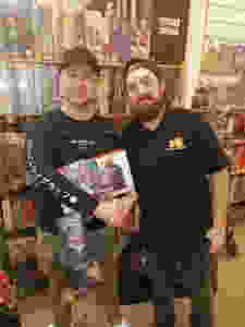 IQ Store owner Stephen Keenan congratulating tournament winner Jake Quinsee