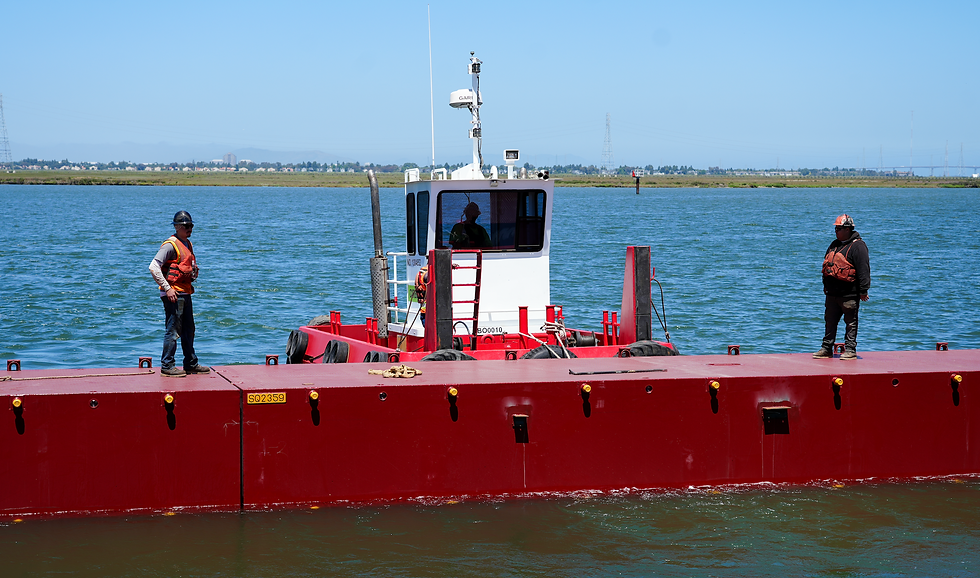 Maritime industry professionals building a barge at wharf 5 at the Port of Redwood City.