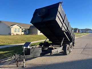 Dump trailer loaded for junk removal and haul-away services in Washington, Ozaukee and Waukesha counties.