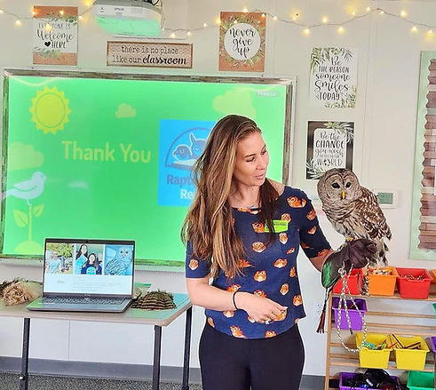 Jess giving educational presentation at a school.JPG