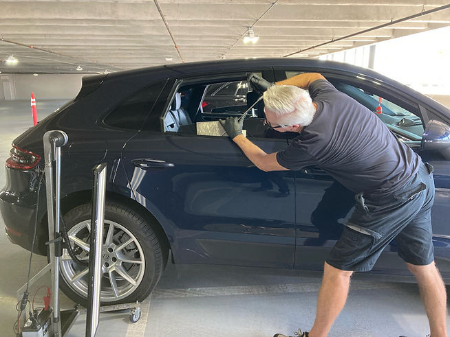 Rick Kennedy removing a dent