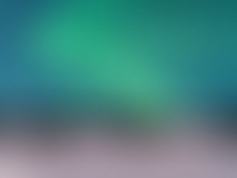 Vivid ribbons of green and purple northern lights dance across the night sky, illuminating the dark landscape below with a soft, otherworldly glow. The shimmering aurora moves gracefully, painting the horizon in breathtaking color.