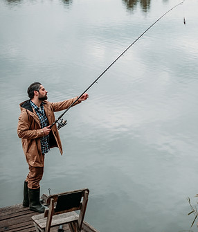fisherman-fishing-with-rod-on-wooden-pier-at-lake-2024-11-17-06-54-36-utc.jpg