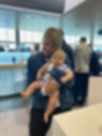 Alicia holds Ollie so I can eat for the first time since 10am