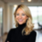 A smiling woman in an office.