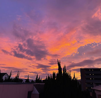 A sunset with bright orange and pink clouds.