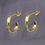 Thumbnail: Gold Polished Textured Hoop Earrings