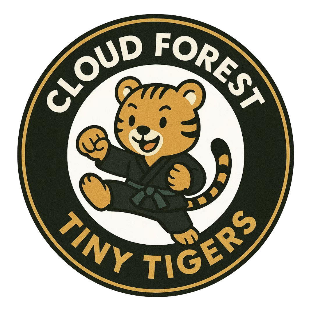 Cloud Forest Tiny Tigers Official Logo (kid tiger kicking and punching with a happy smile)
