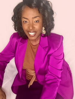 Seated Purple Jacket Headshot 2025