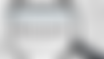 a written paper with a magnifying glass over the word Research.