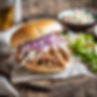 pulled pork sandwich with coleslaw on a bun.jpg