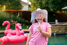 Kids enjoying large outdoor party games with friends during a backyard celebration in Denton TX