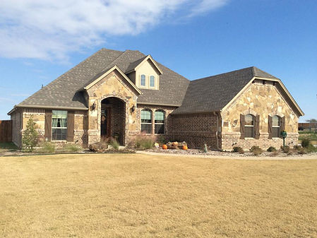 A home featuring the masonry and stone work of Southwest Brick and fireplace.