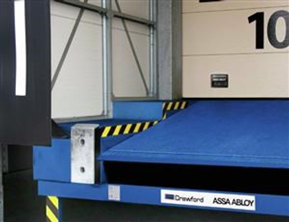 Dock Leveler Bridges the gap to ensure smooth and safe transfer of goods between Vehicle and Loading Dock