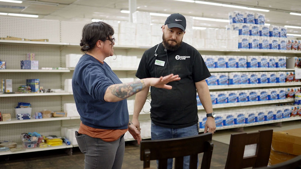 Customer being helped by Bargain Lane employee