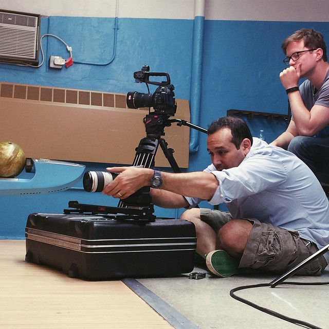 Big Teeth Productions Gregg Jaffe framing a shot at a bowling alley for a comedy shoot