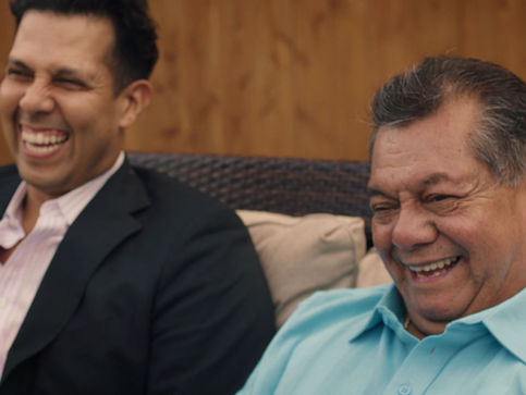 Father and son watching something happy