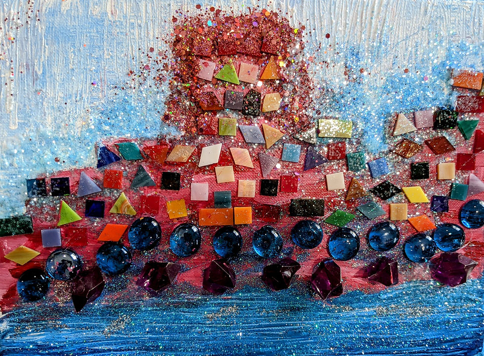 Colorful mosaic artwork created in a RAZ Land workshop, featuring a textured background with vibrant glass tiles, geometric shapes, glitter, and shimmering embellishments arranged in an abstract composition over a blue and red painted surface.